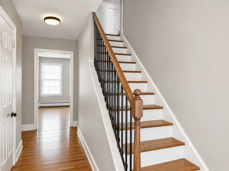Staircase after rails, treads & paint — Holyoke, MA