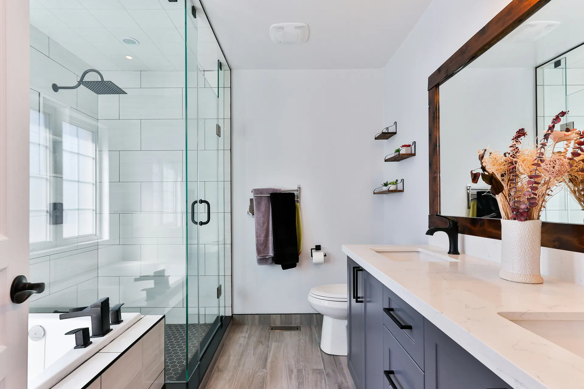 Remodeled bathroom with new tile and vanity