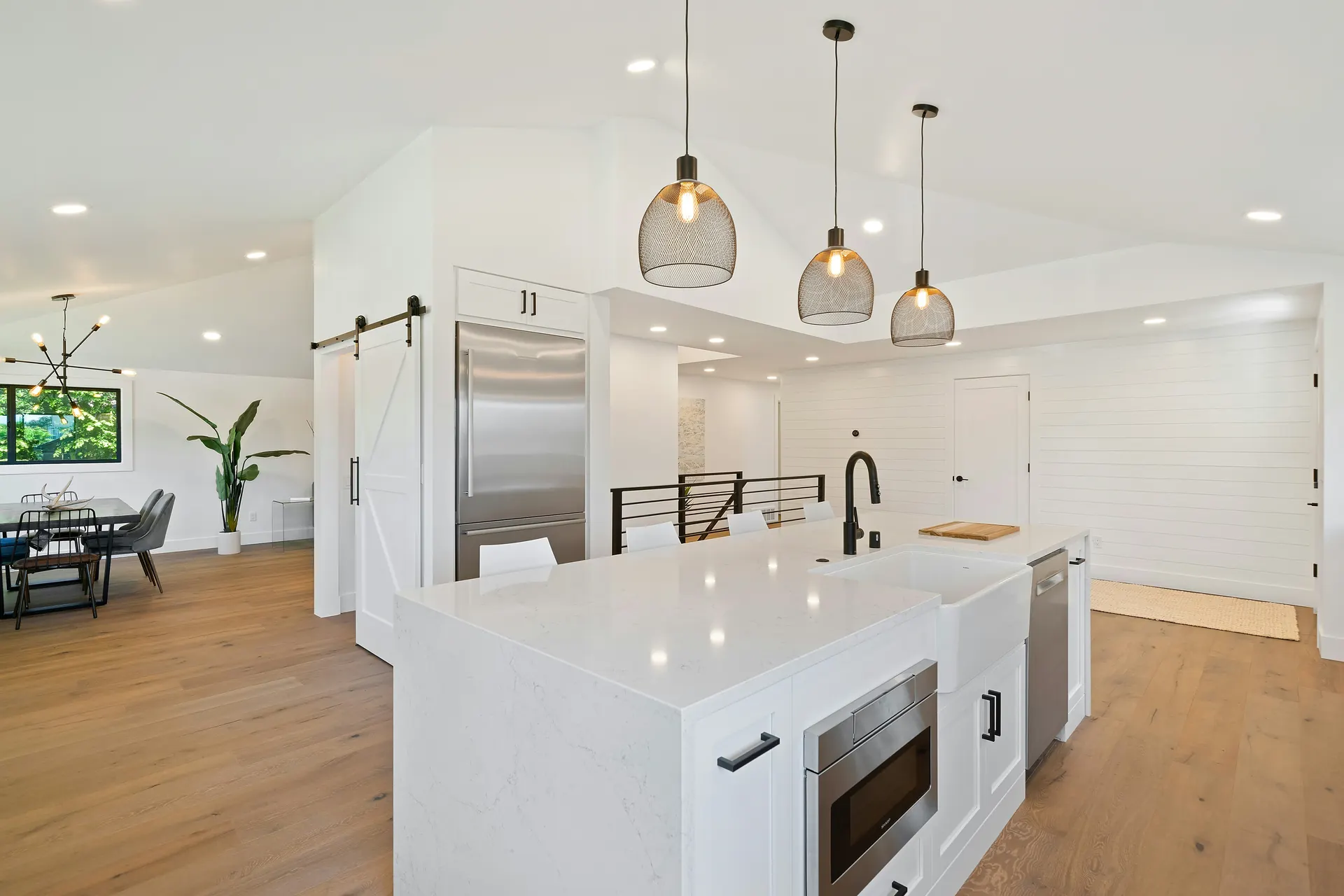 Modern remodeled kitchen with white cabinets